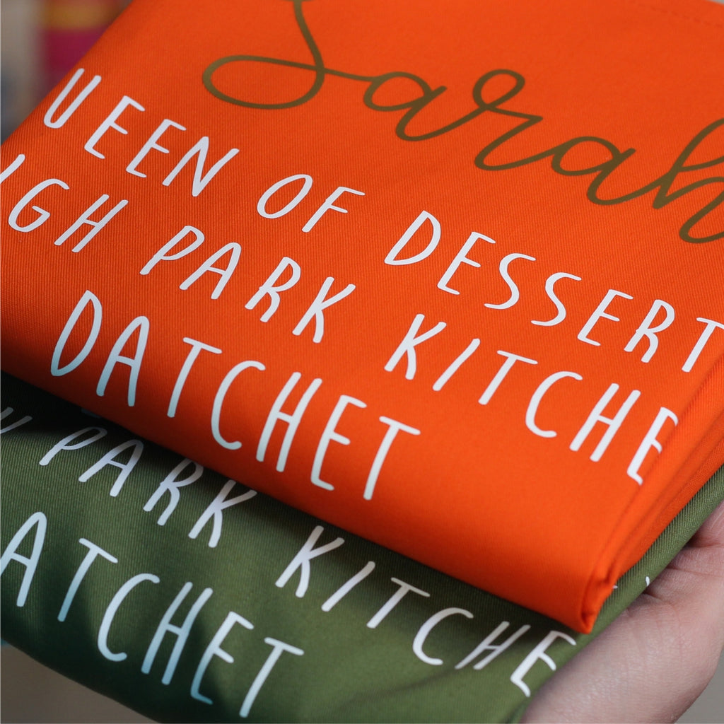 Personalised adult apron in orange and green with custom name