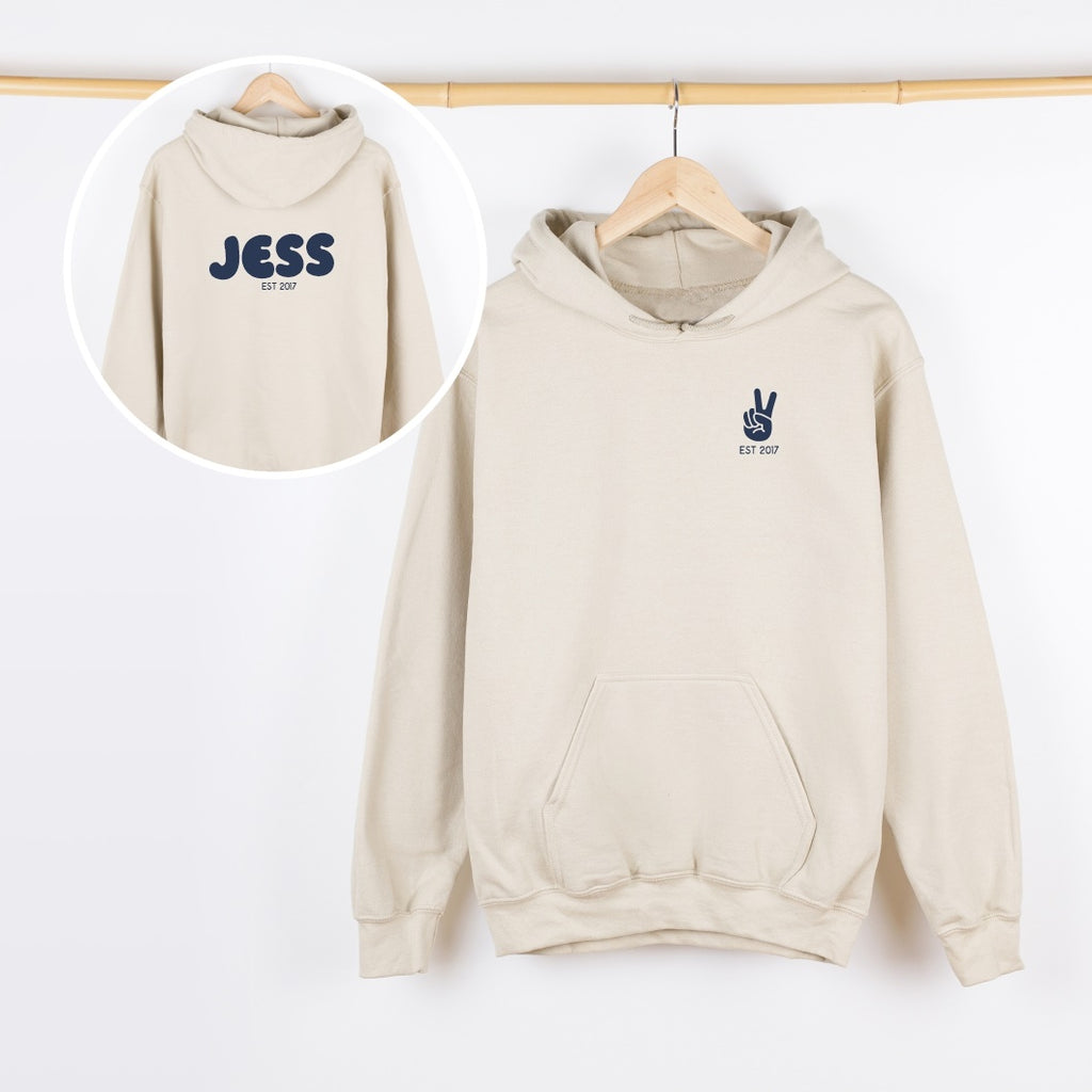 Beige hoodie with 'JESS' branding on a white background