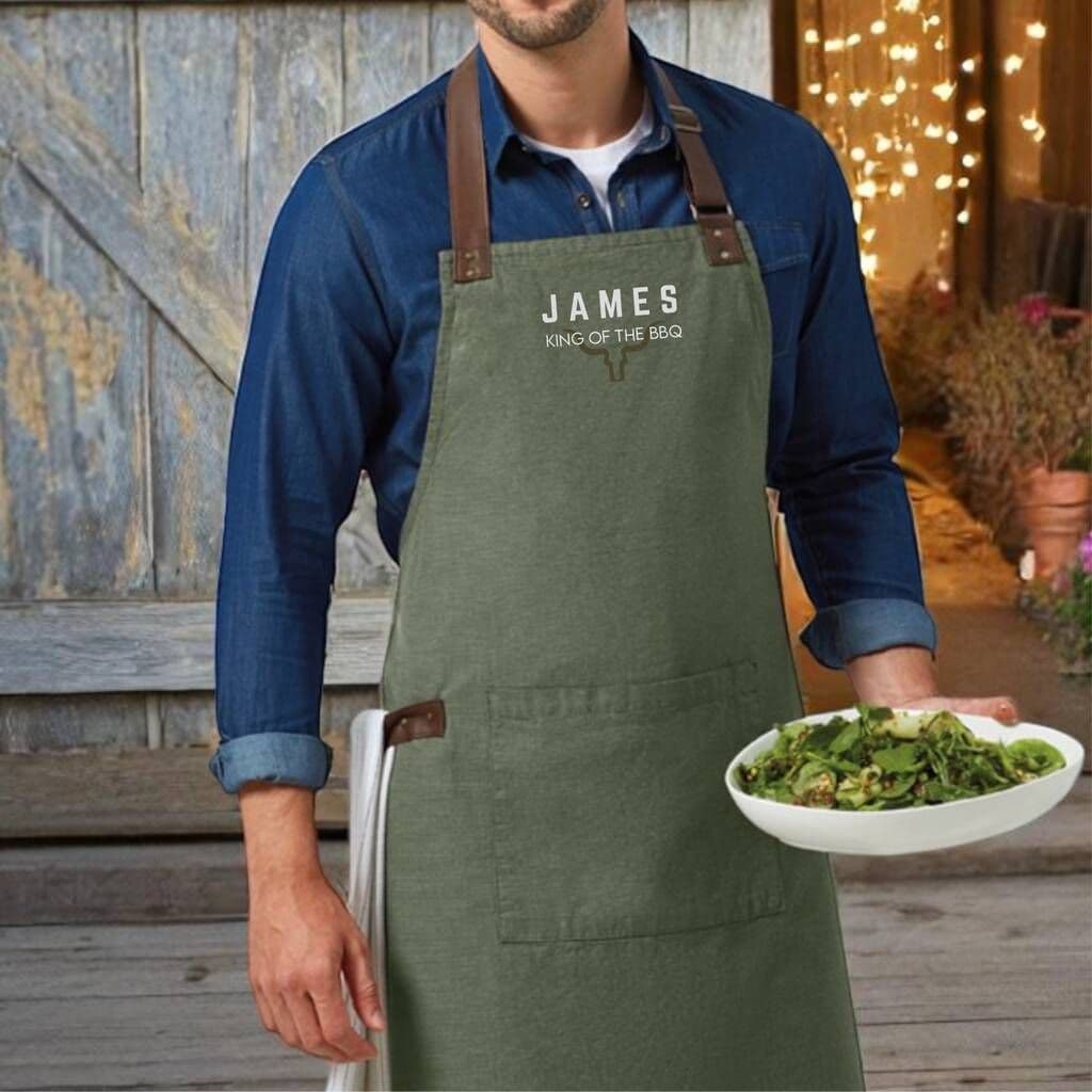 King Of The Barbecue Personalised Luxury Apron â€” The perfect gift for a BBQ legend â€” this luxury adults' apron features premium fabric with stylish leather-look straps, and can be