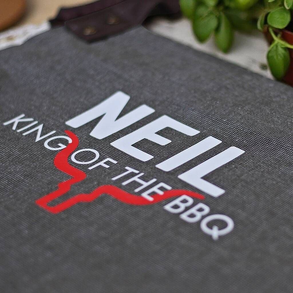 King Of The Barbecue Personalised Luxury Apron â€” The perfect gift for a BBQ legend â€” this luxury adults' apron features premium fabric with stylish leather-look straps, and can be