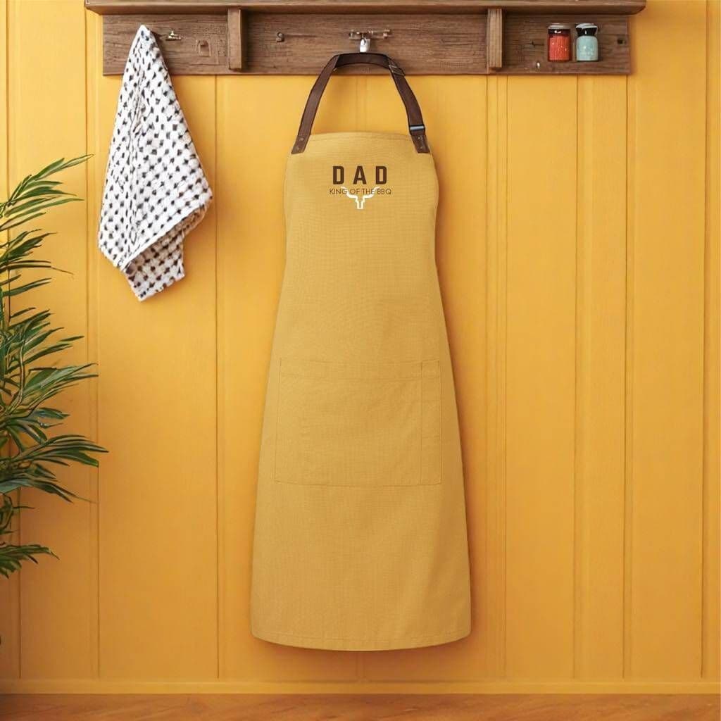 King Of The Barbecue Personalised Luxury Apron â€” The perfect gift for a BBQ legend â€” this luxury adults' apron features premium fabric with stylish leather-look straps, and can be