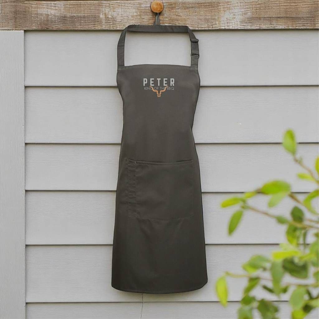 King Of The BBQ Personalised Apron â€” Ideal for summer barbecues, cooking in the kitchen, or manning the grill with pride â€” a must-have for dads who love to cook and enjoy being