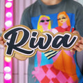 Person holding a sign with 'Riva' in front of a colorful background