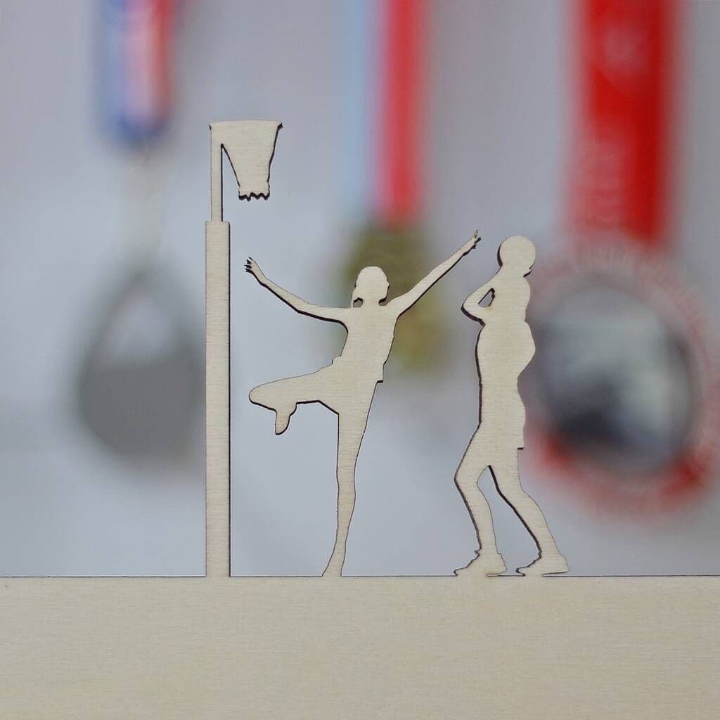 Decorative cutout of two people with a flagpole on a blurred background
