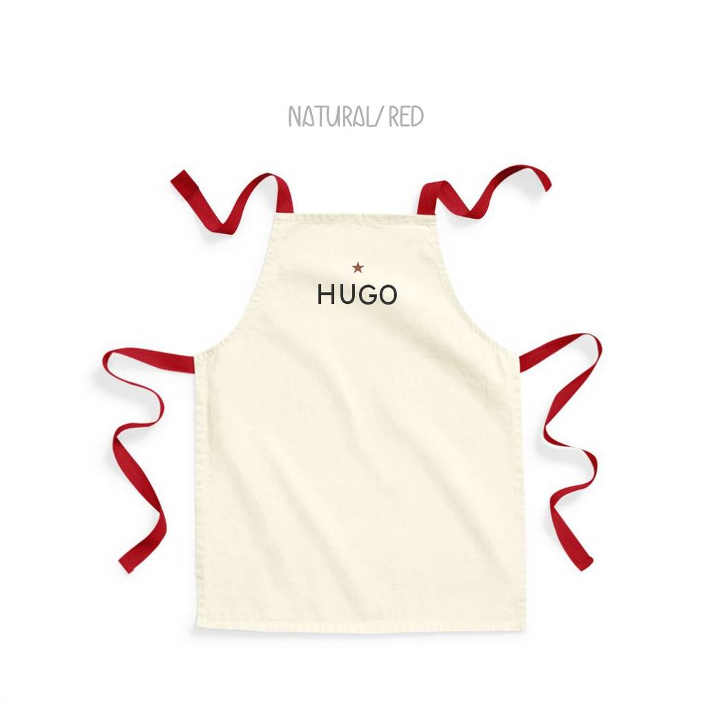 Beige apron with red ribbons and 'HUGO' branding on a white background