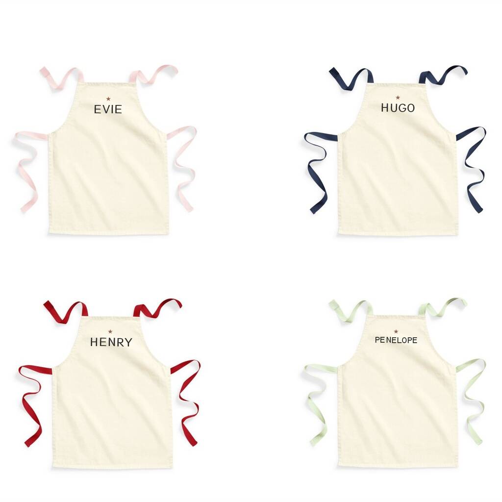 Four children's aprons with names 'Evie', 'Hugo', 'Henry', and 'Penelope' on a white background.