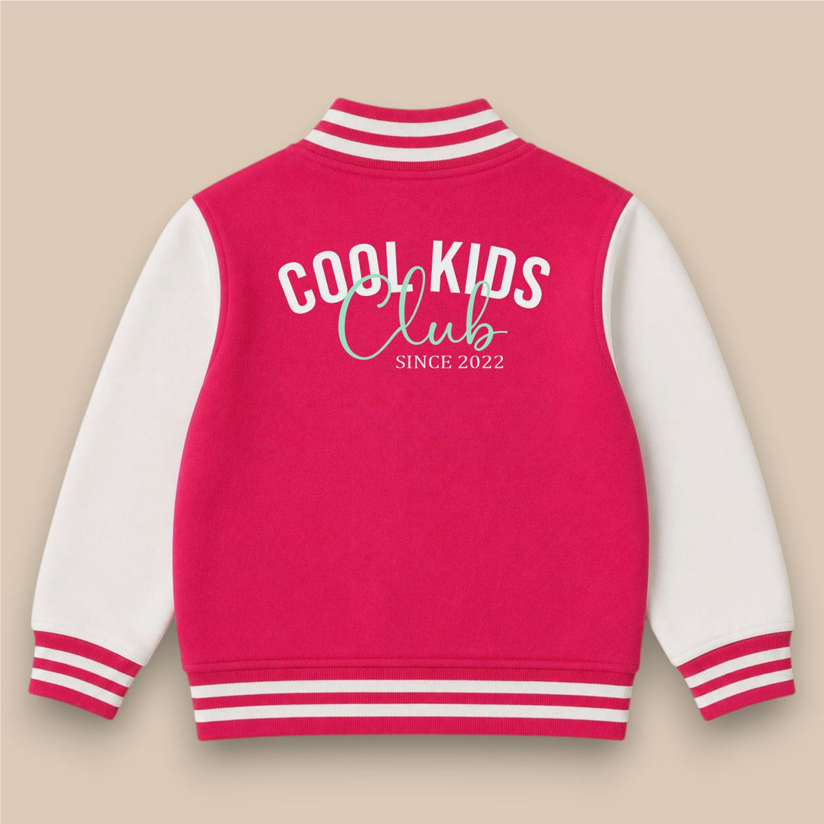A bright pink and white varsity jacket with 'Scarlett' embroidered in white script on the chest, displayed against a solid beige background.
