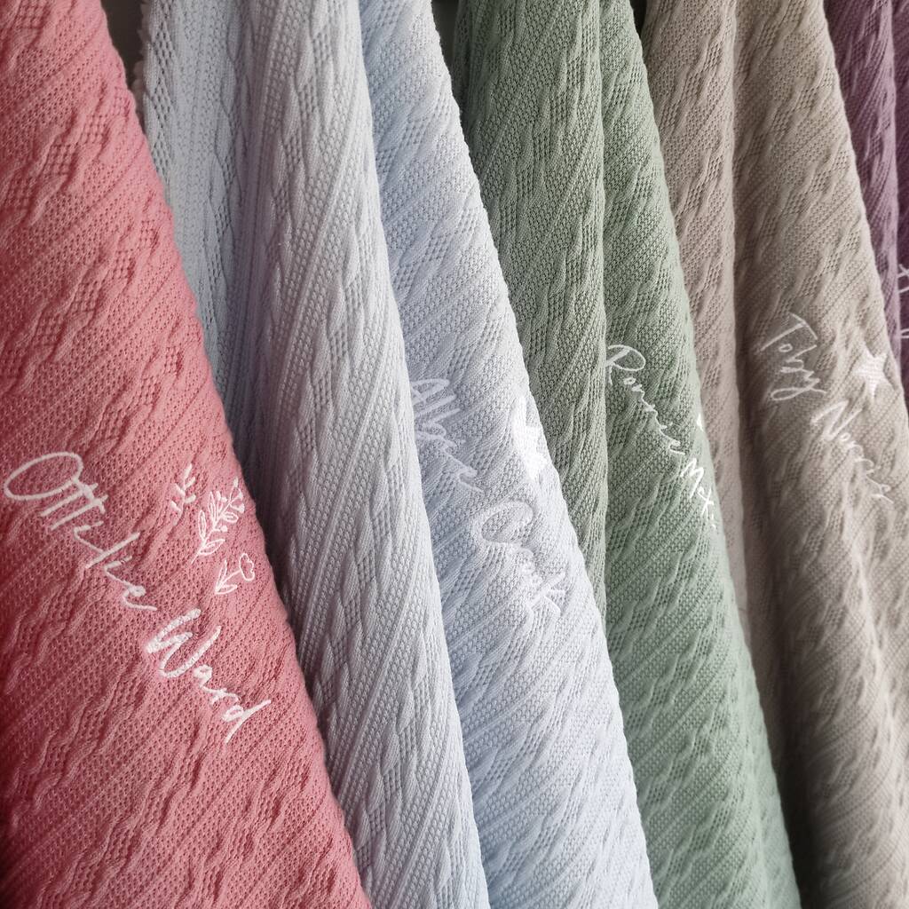Row of textured fabric swatches in various colors with visible branding.