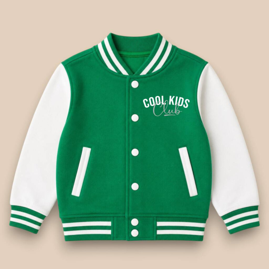 A green and white varsity jacket with 'COOL KIDS Club' embroidered on the chest, displayed against a solid beige background.