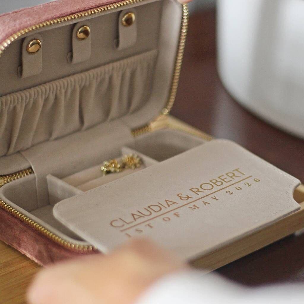 Jewelry box with personalized engraving on a wooden surface
