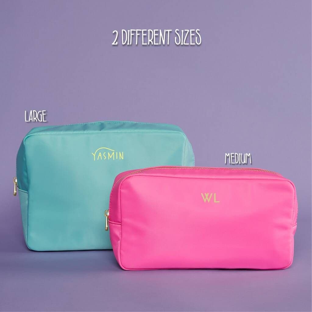 Two cosmetic bags, one teal and one pink, with 'YASMIN' and 'WL' branding on a purple background.