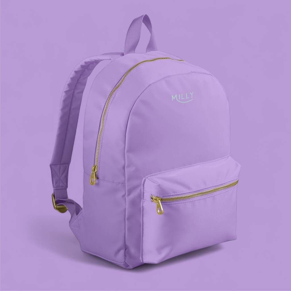Purple backpack with gold zippers on a matching purple background