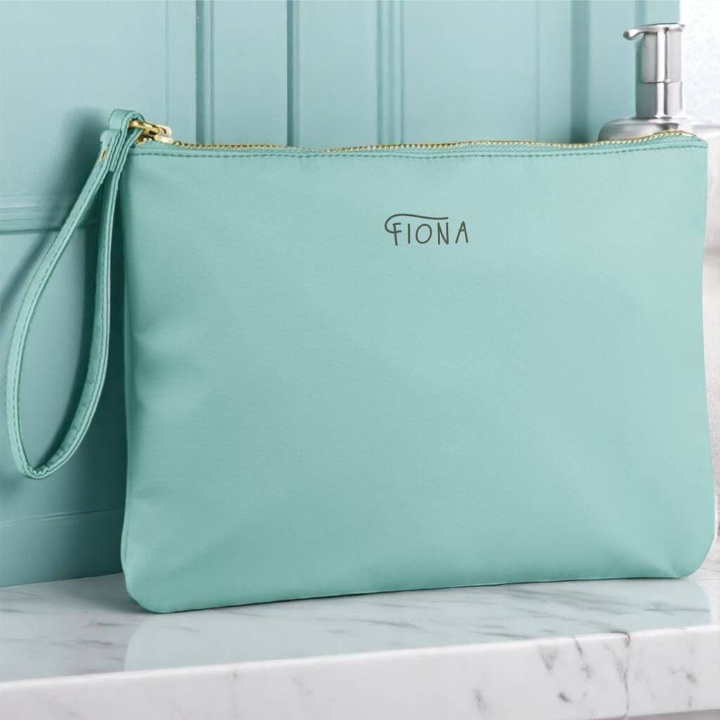 Light blue pouch with 'Fiona' branding on a marble surface.