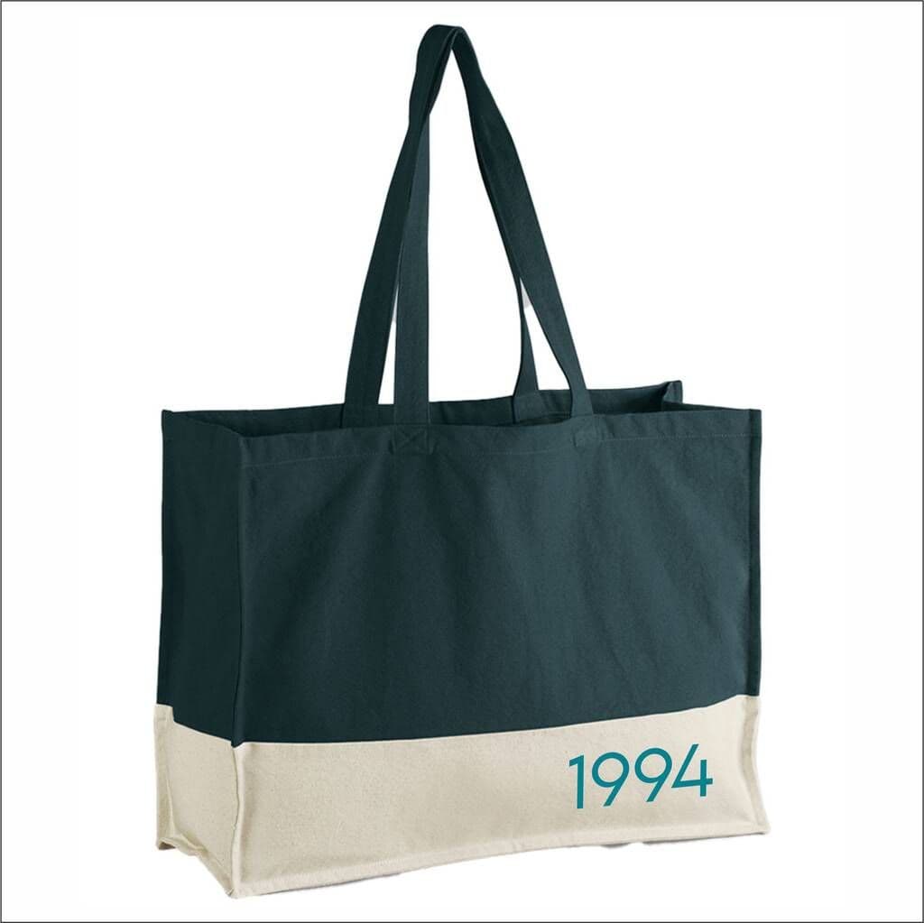Black and beige tote bag with '1994' printed on a white background