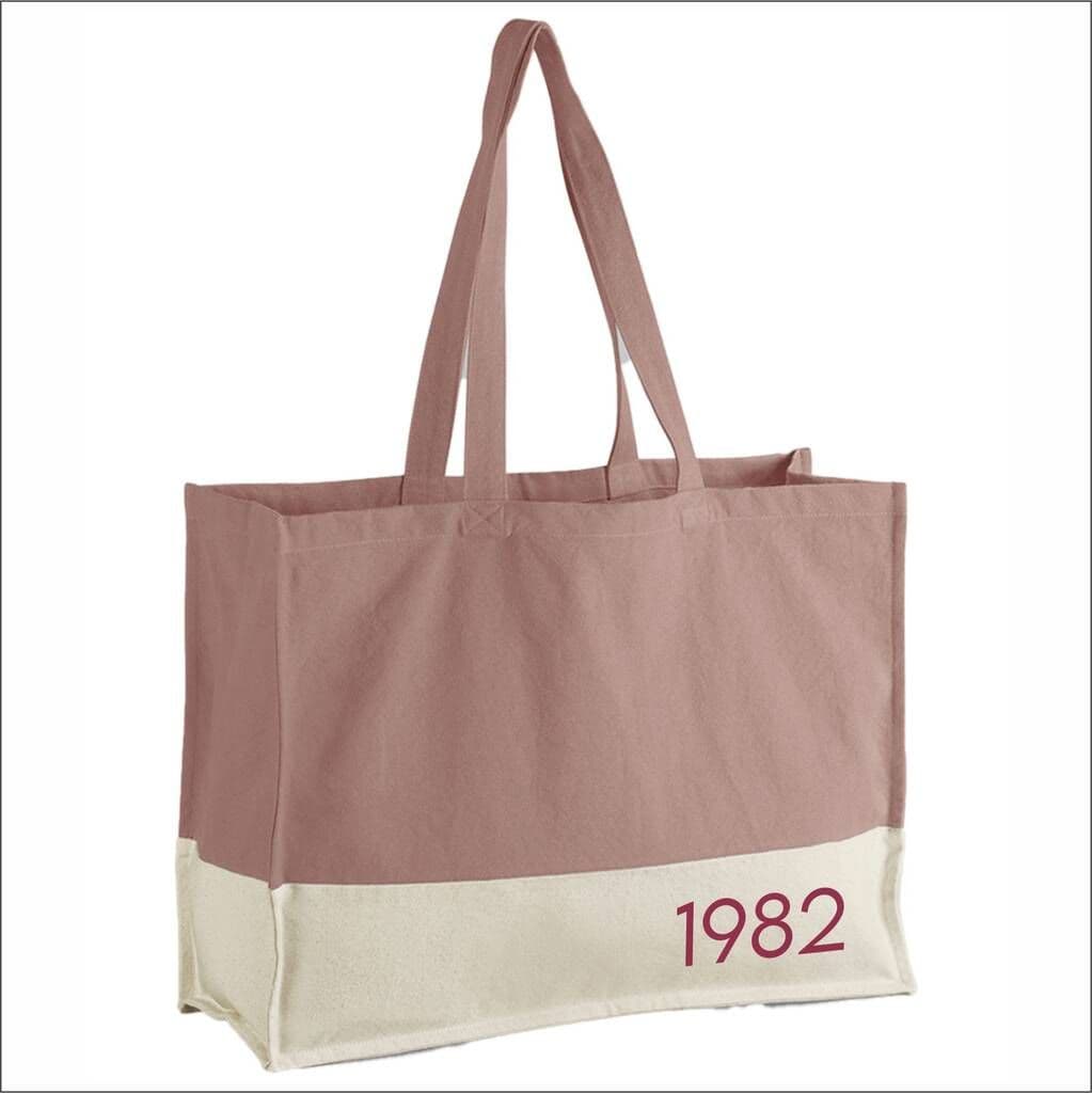 Tote bag with '1982' printed on a white background